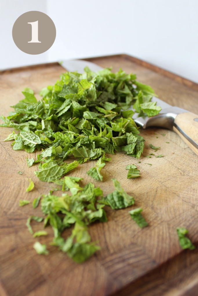Cut Mint with a knife on a cutting board.