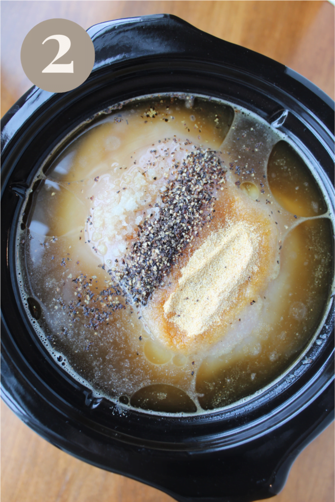 Placed ingredients into the crockpot with spices on top.