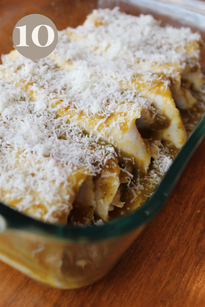 Enchiladas with cheese sprinkled on top.