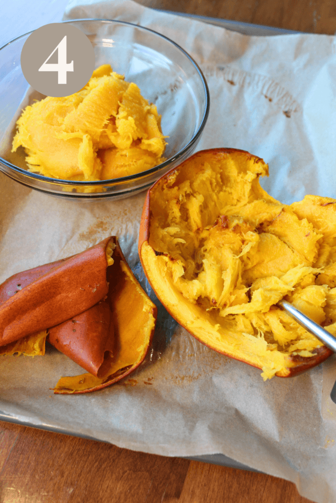 A pumpkin half with the flesh scooped out.