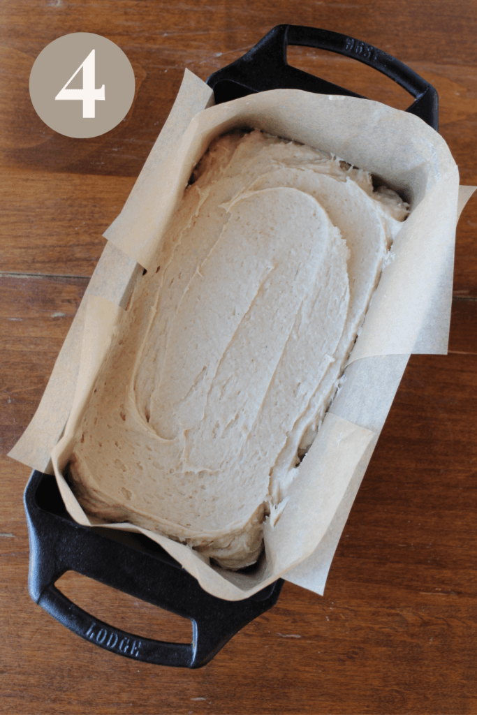 Gluten free bread batter poured into a cast iron bread pan.