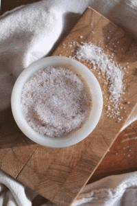 Real salt in a small bowl on a mini cutting board.